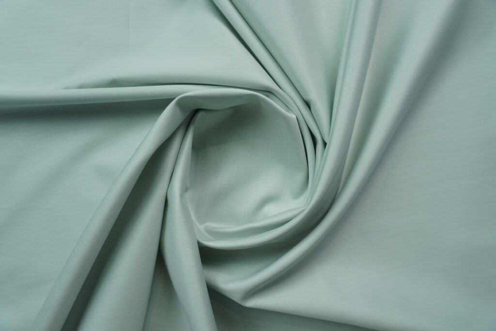 Premium Fashion Fabrics Online for Suits, Shirts & Blazers | Fashion Fabric 33 Mint Green Cotton Shirting Fabric by Tessitura Monti India is crafted from premium 2 Ply 140’s cotton with a soft, smooth and elegant finish. This Mint Green Cotton Shirting Fabric comes in a fresh light green shade, perfect for formal shirts, summer shirts and premium tailoring. The refined texture and breathable comfort make this Mint Green Cotton Shirting Fabric a great choice for men who want a classy and luxury shirt. Choose this Mint Green Cotton Shirting Fabric for a fresh colour, rich quality and premium tailored look.